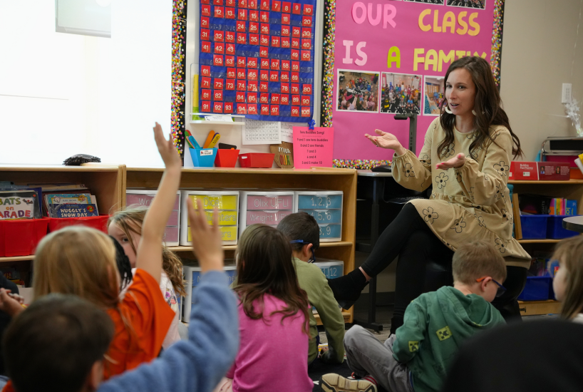 teacher asks students a question during class